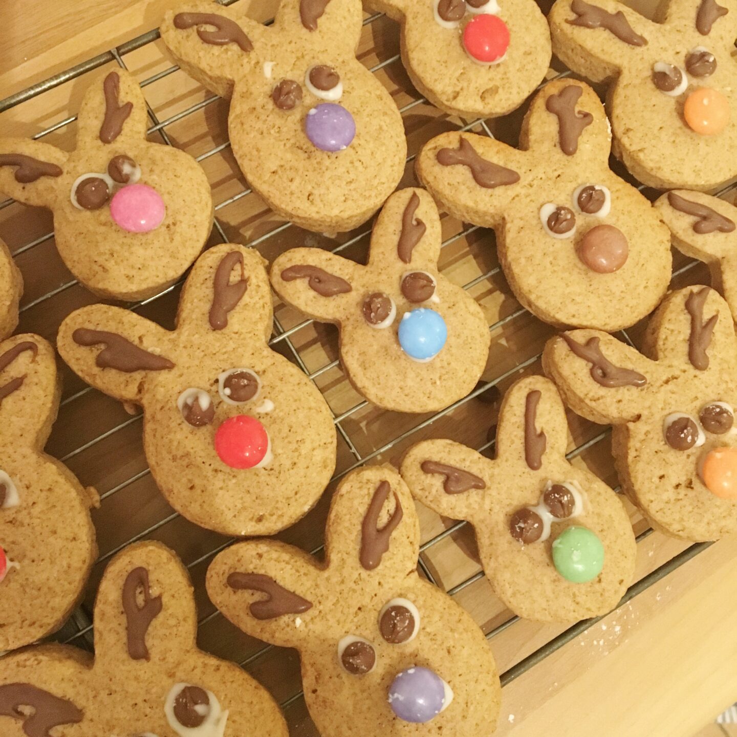 Finished reindeer cookies on a wire rack to cool.