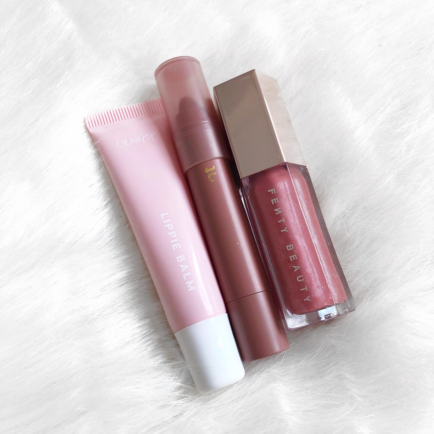 ColourPop lip balm and lip crayon. Fenty Fussy gloss bomb for Packing Makeup for Holiday