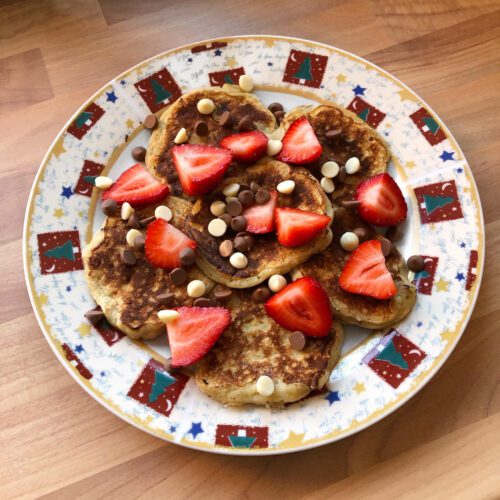 banana pancakes with strawberries and chocolate chips