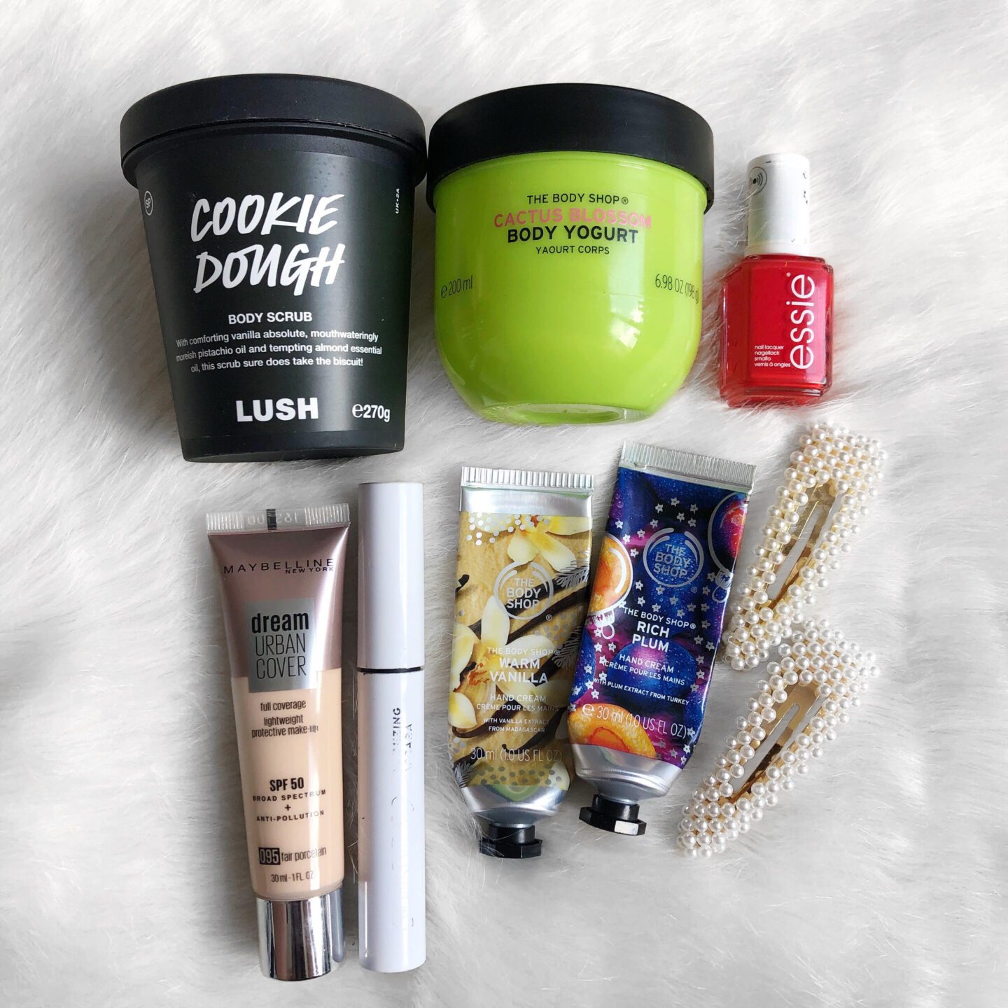 A flatlay of makeup and skincare products for a beauty empties review post