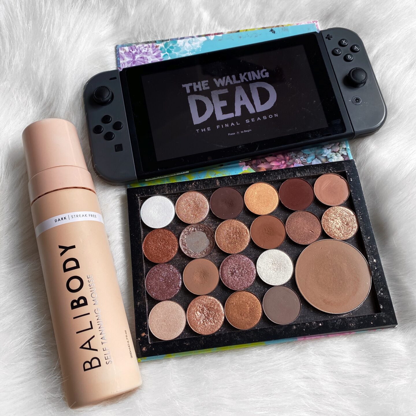 September Favourites | Makeup flatlay with Nintendo Switch and Fake Tan