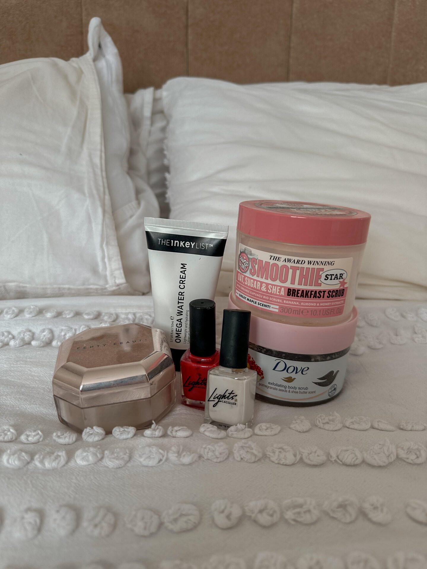 The products in my empties post photographed together on the bed
