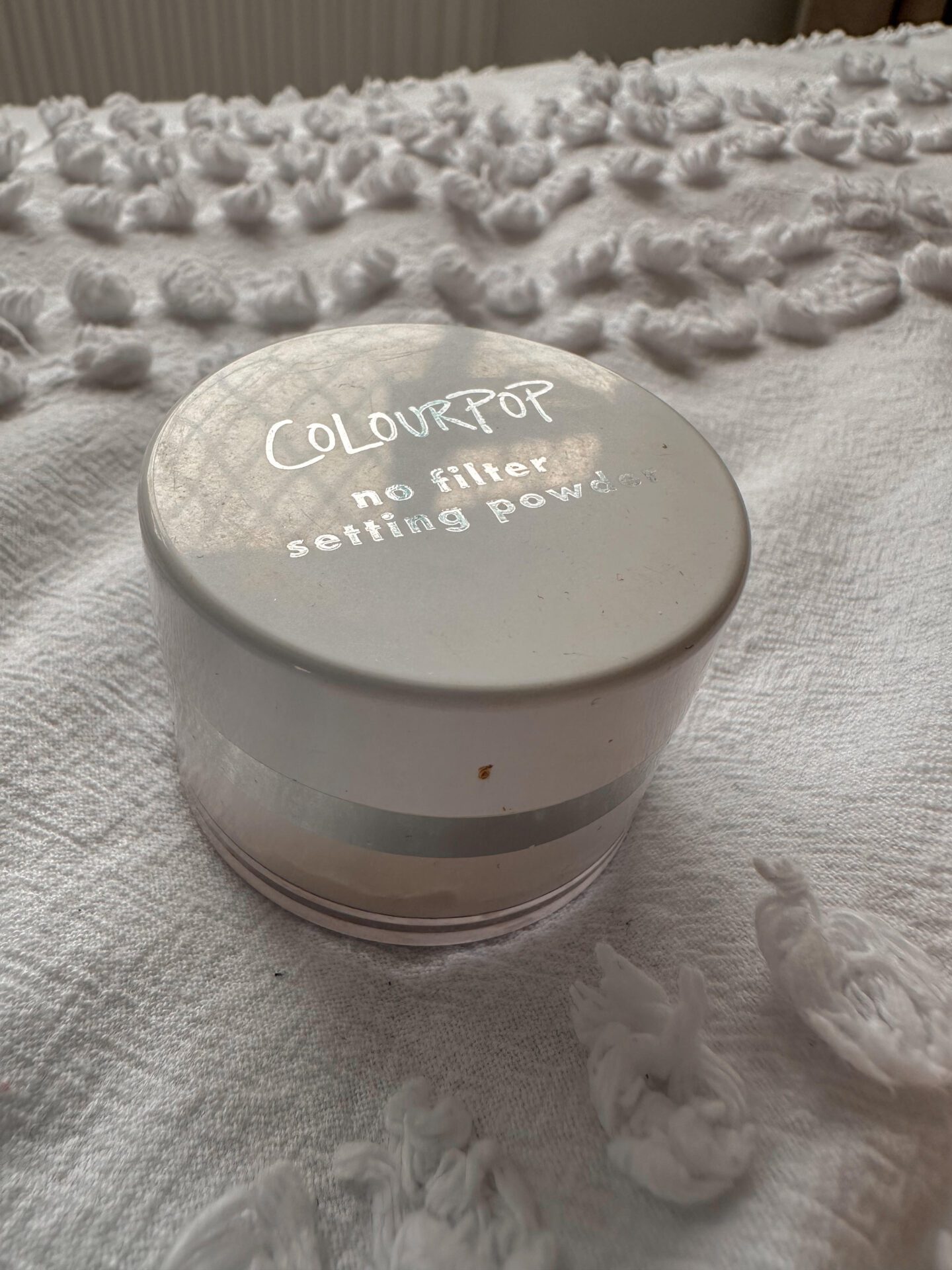 Empty pot of ColourPop No Filter Setting Powder